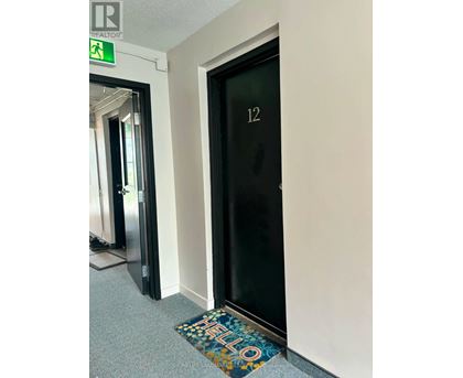 A door with a glass panel and the number 12 on it.