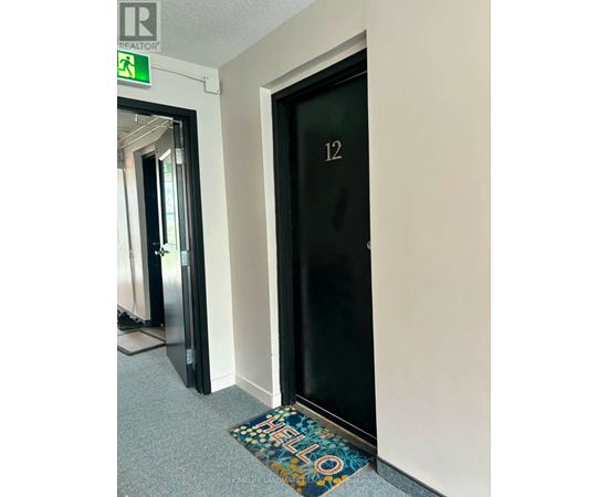 A door with a glass panel and the number 12 on it.