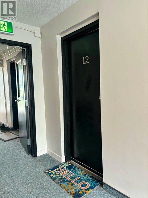 A door with a glass panel and the number 12 on it.