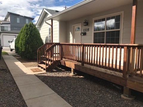 A house numbered 1335 with a wooden porch.