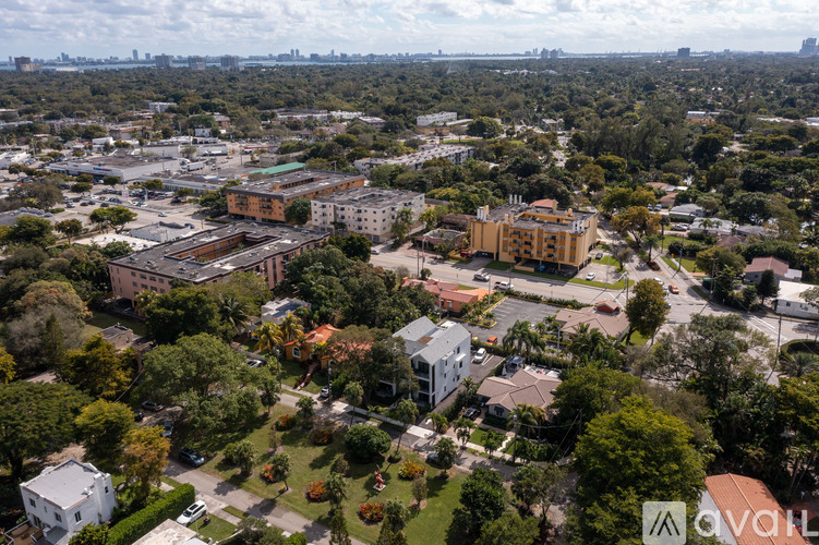 An aerial view of a city with buildings and trees.