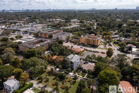 An aerial view of a city with buildings and trees.