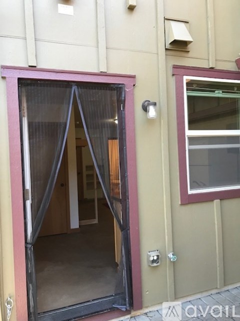 A door with a glass window is open.