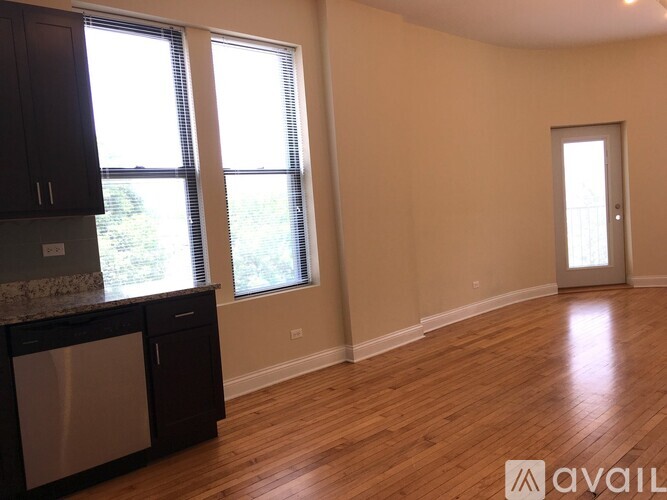 A kitchen with wooden floors and a dishwasher.