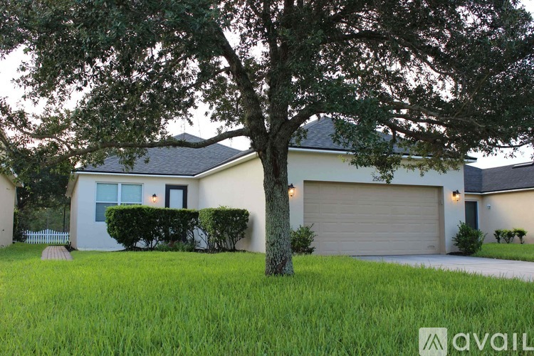 A house with a tree in front of it.