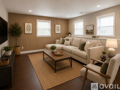 A living room with a couch, chair, and coffee table.
