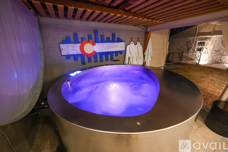 A hot tub with a blue light in the middle of it.