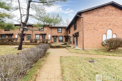 A brick building with a walkway in front of it.