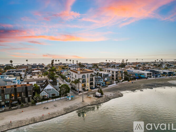 A beachfront town with a mix of residential and commercial buildings.