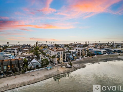A beachfront town with a mix of residential and commercial buildings.