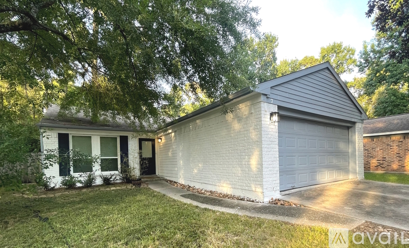 A house with a garage is for sale.