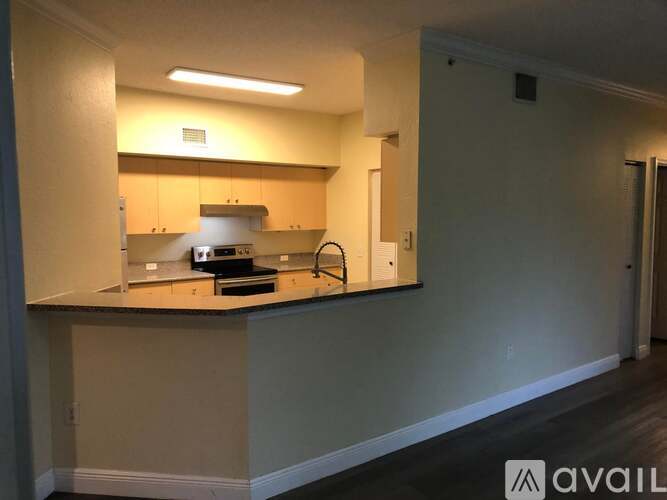 A kitchen with a counter and a sink.