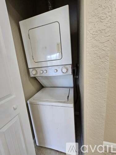 A white oven and dishwasher are installed in a kitchen.
