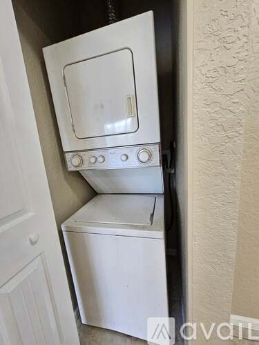 A white oven and dishwasher are installed in a kitchen.