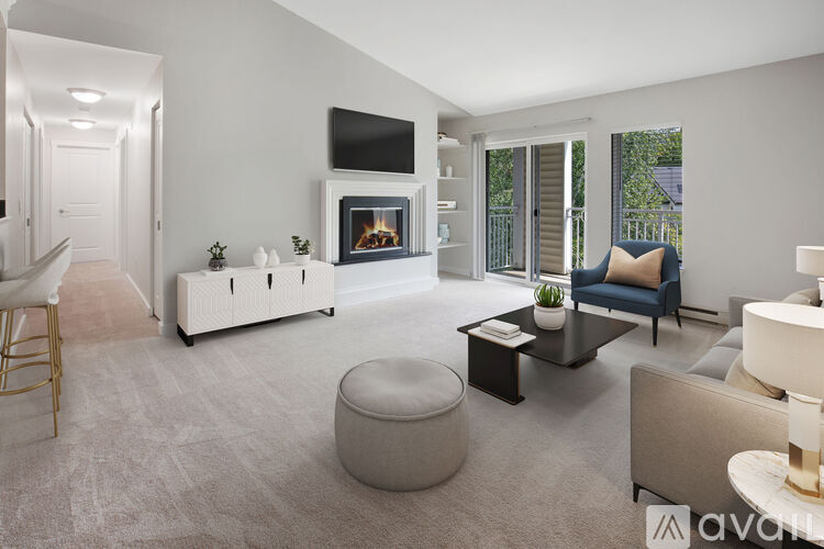 A modern living room with a fireplace and a flat screen TV.