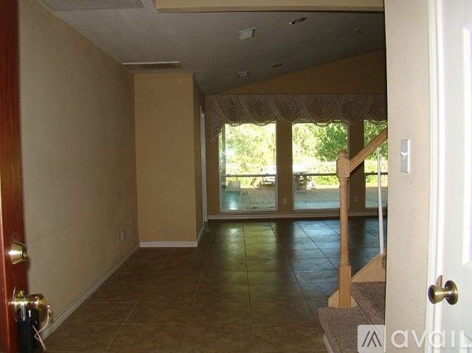 A room with a door and a window.