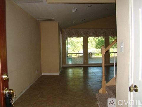 A room with a door and a window.