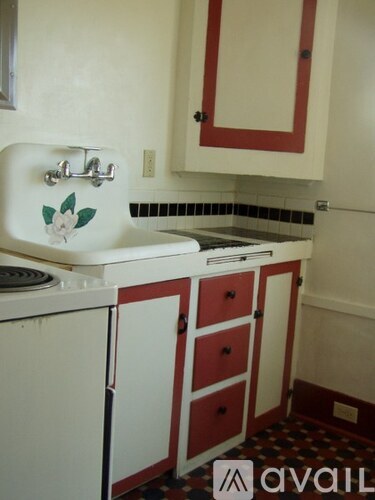 A bathroom with a sink and a washer and dryer.