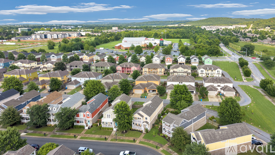 A bird's eye view of a residential area with houses and streets.