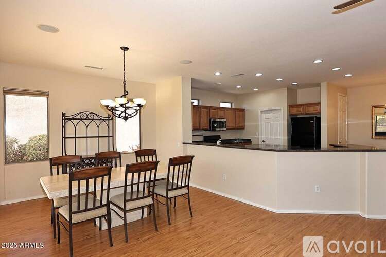 A dining room with a table set for four.