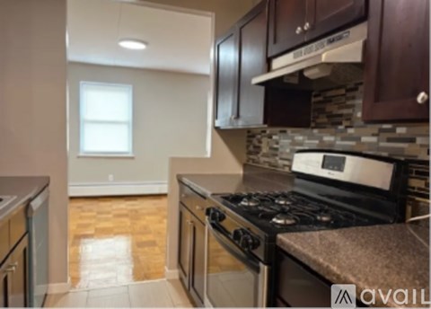 A kitchen with a stove top oven and a dishwasher.