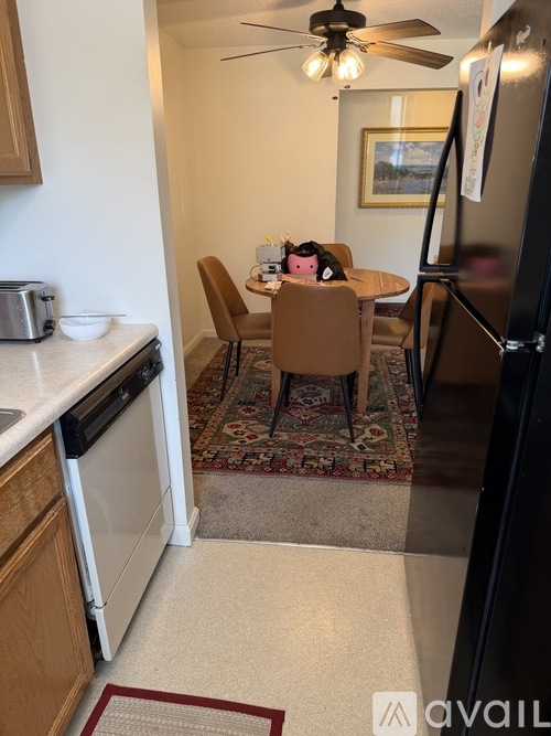 A kitchen with a table and chairs in the middle of the room.