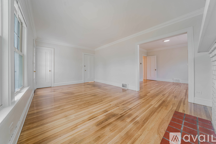 A room with wooden floors and white walls.