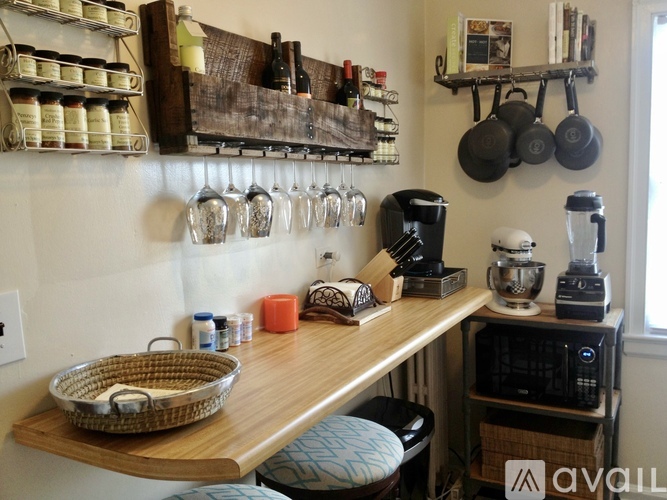 A kitchen with a wooden counter and a basket on it.