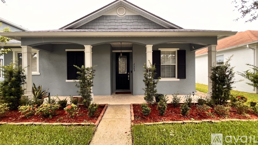A house with a front yard and a sign that says "available".