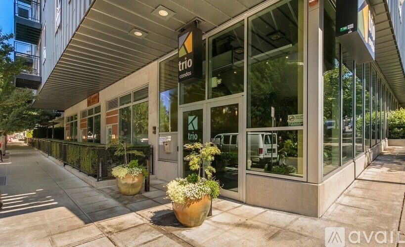 A trio storefront with a glass door and windows.