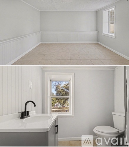 A bathroom with a white sink and toilet.