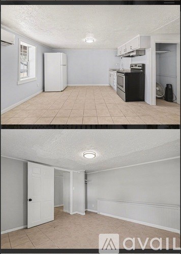 A kitchen with white appliances and a white refrigerator.