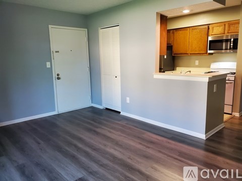 A kitchen area with a countertop and cabinets.