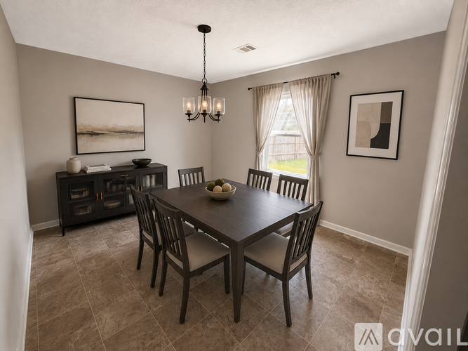A dining room with a table set for four.