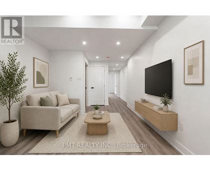 A living room with a couch, a coffee table, and a television.