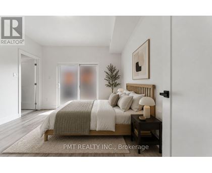 A bedroom with a bed, nightstand, and a small tree.