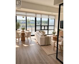 A modern living room with a large window and a view of the outside.