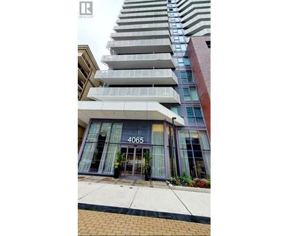 A tall building with a glass entrance and the number 4065 on it.