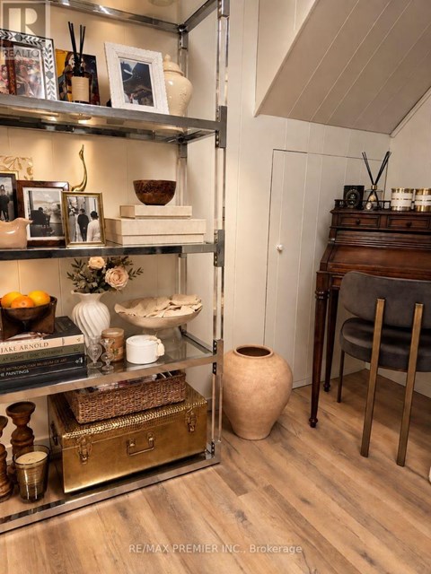 A shelf with various decorative items is displayed in a room.