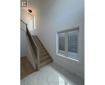 A staircase with a window above it.