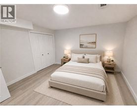 A bedroom with a large bed, two nightstands, and a painting on the wall.