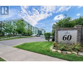A sign for Wilshire 60 Flex Crescent is displayed in front of a building.