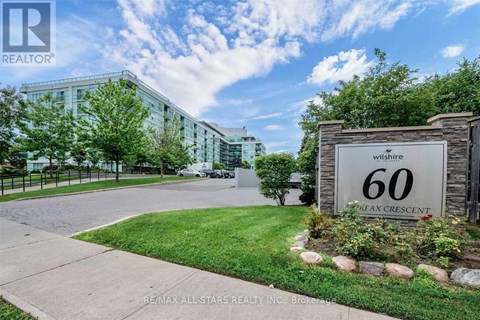 A sign for Wilshire 60 Flex Crescent is displayed in front of a building.