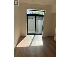 A room with a glass door leading outside.
