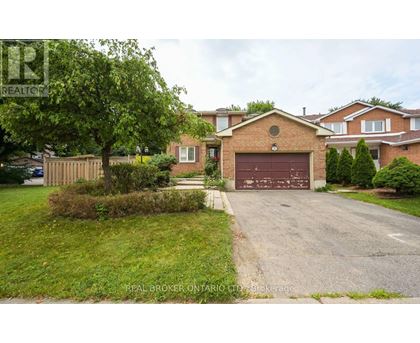 A residential area with a house and a garage.