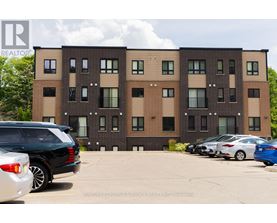 A building with a car parked in front of it.