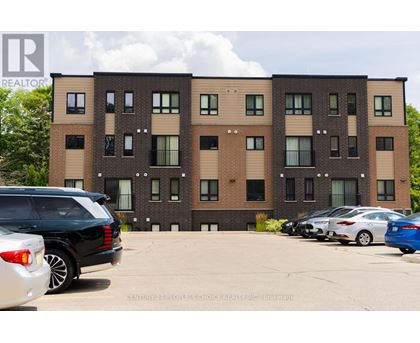 A building with a car parked in front of it.