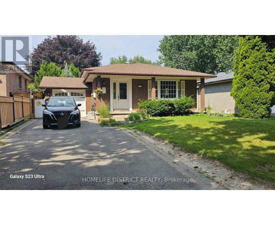A black car is parked in front of a house with a sign that says "Galaxy S23 Ultra".