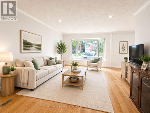 A living room with a white couch and a wooden coffee table.