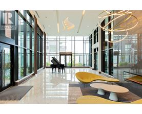 A piano is in the middle of a room with a lot of windows.